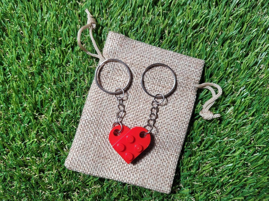 Matching couples heart keychain set with Lego-style interlocking heart halves symbolizing connection